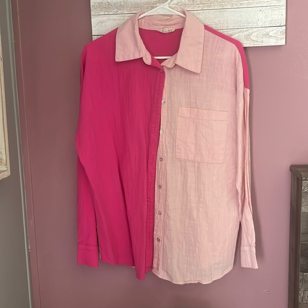 Size m long sleeved button up with pocket in front